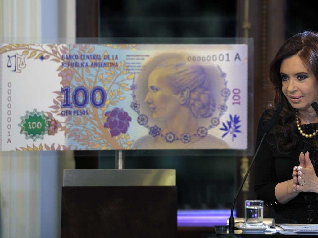 Argentine president Cristina Fernandez de Kirchner speaks during the unveiling of the new 100 peso note