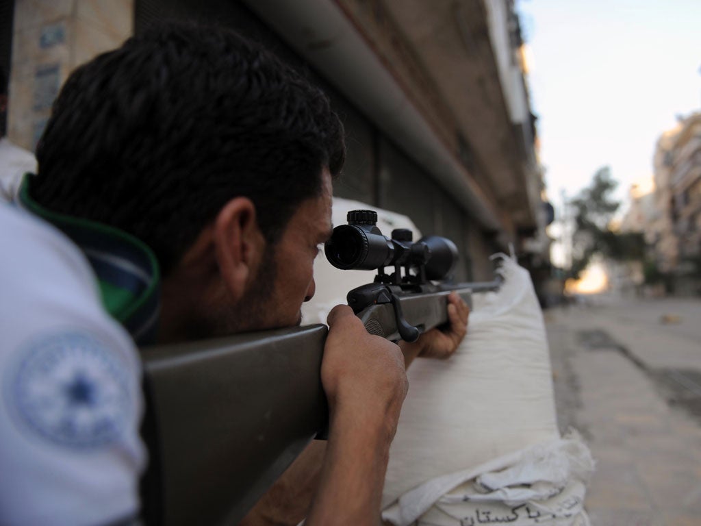 A Syrian rebel battles with regime forces in Aleppo on Wednesday