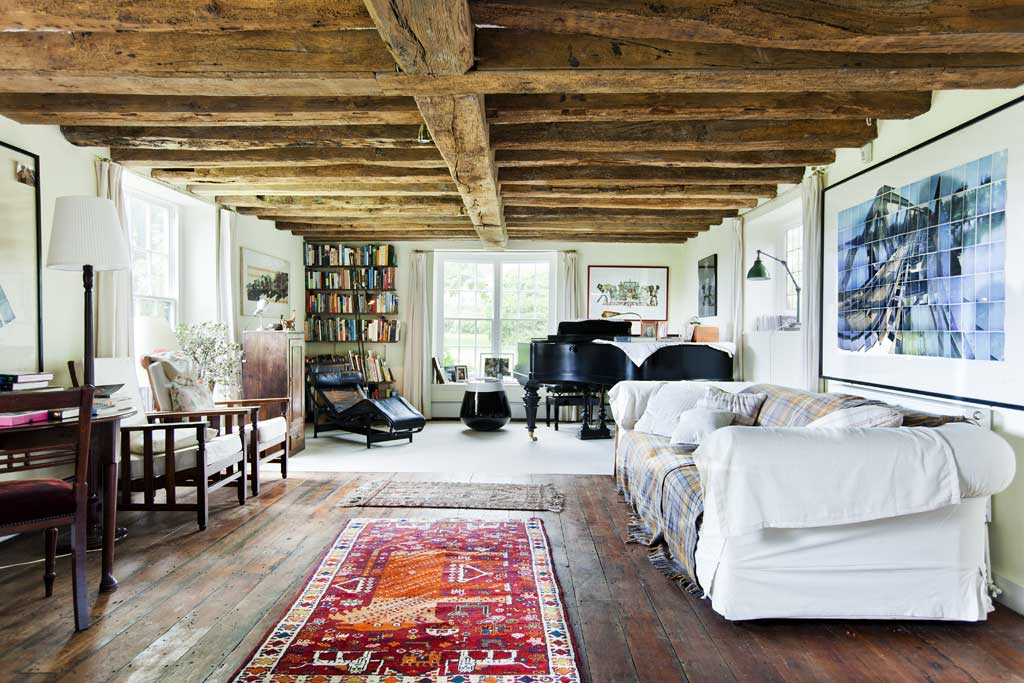 Peace and quiet: The house is all thick wooden beams, stripped floorboards and cavernous fireplaces