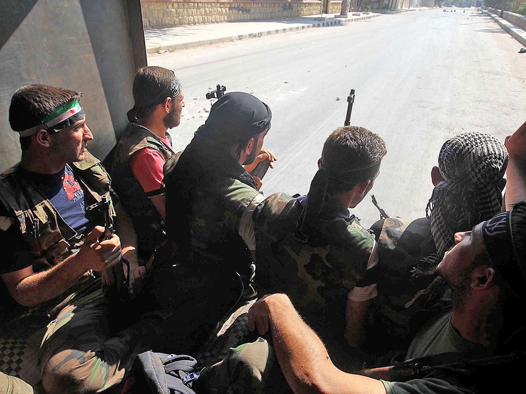 Syrian rebel fighters near Syria’s second city of Aleppo yesterday