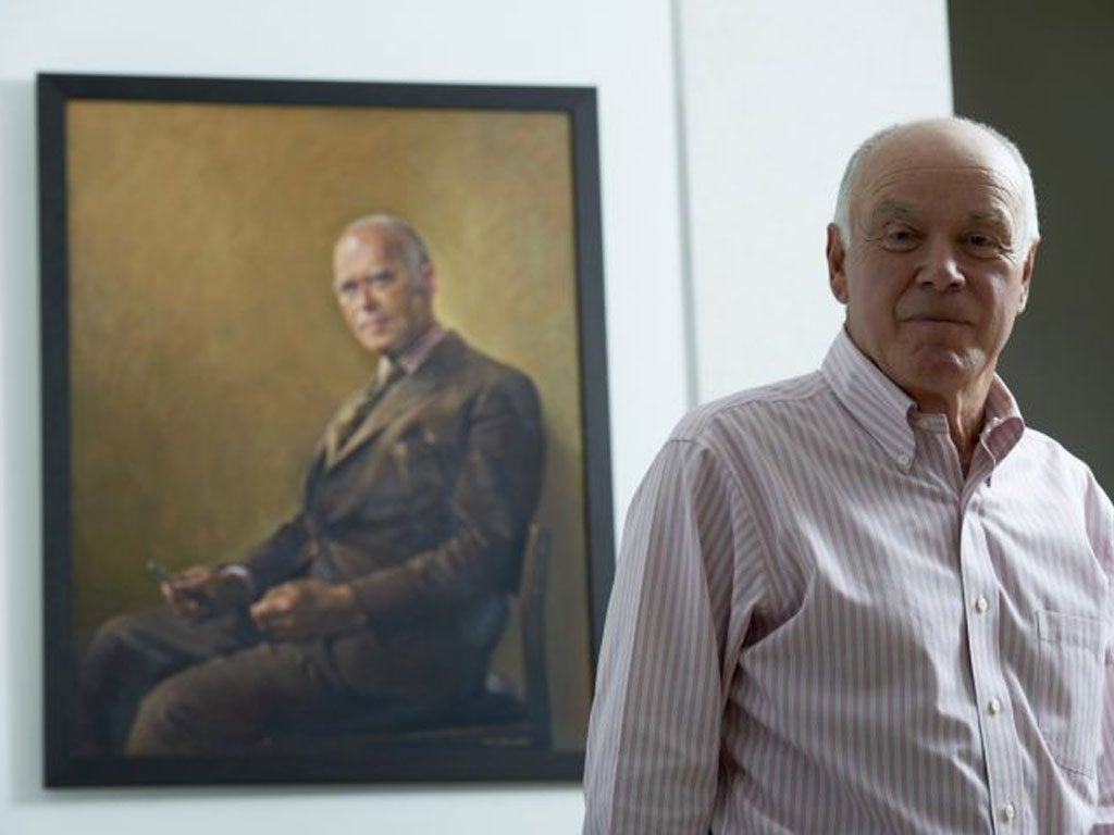 Thomas Black with a portrait of his refugee father, Peter