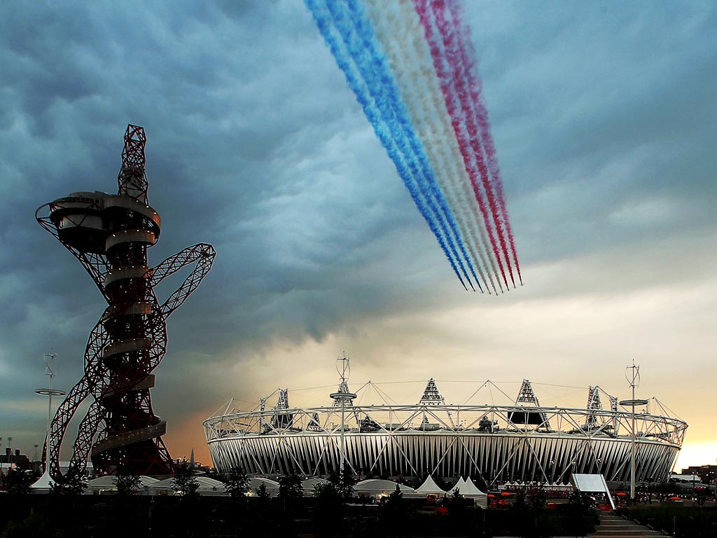 The Red Arrows pass over the Olympic Stadium