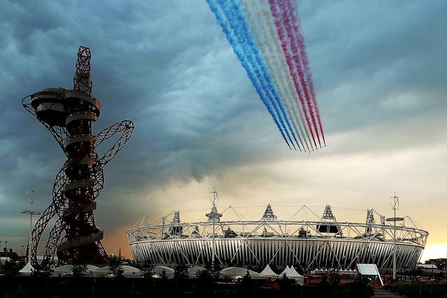 The Red Arrows pass over the Olympic Stadium