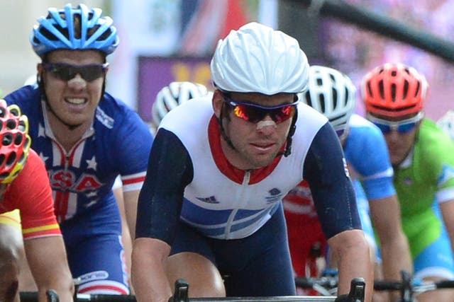 Mark Cavendish of Britain crosses the line at the end of the men's cycling road race event