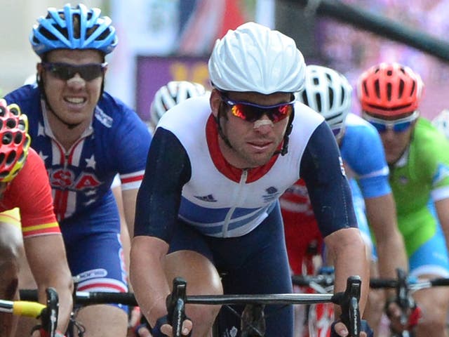 Mark Cavendish of Britain crosses the line at the end of the men's cycling road race event