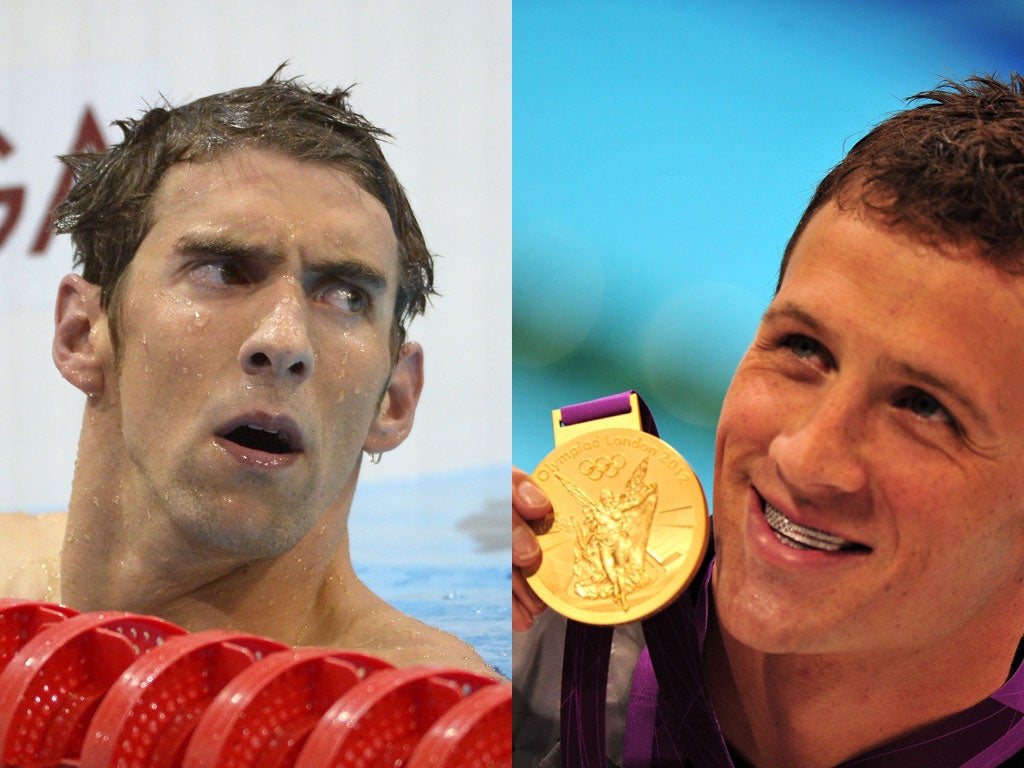 Changing of the guard: Phelps (left) was left in Lochte's wake as his rival romped home to take gold