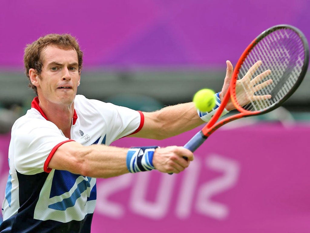 Britain’s Andy Murray stretches on his way to a convincing win