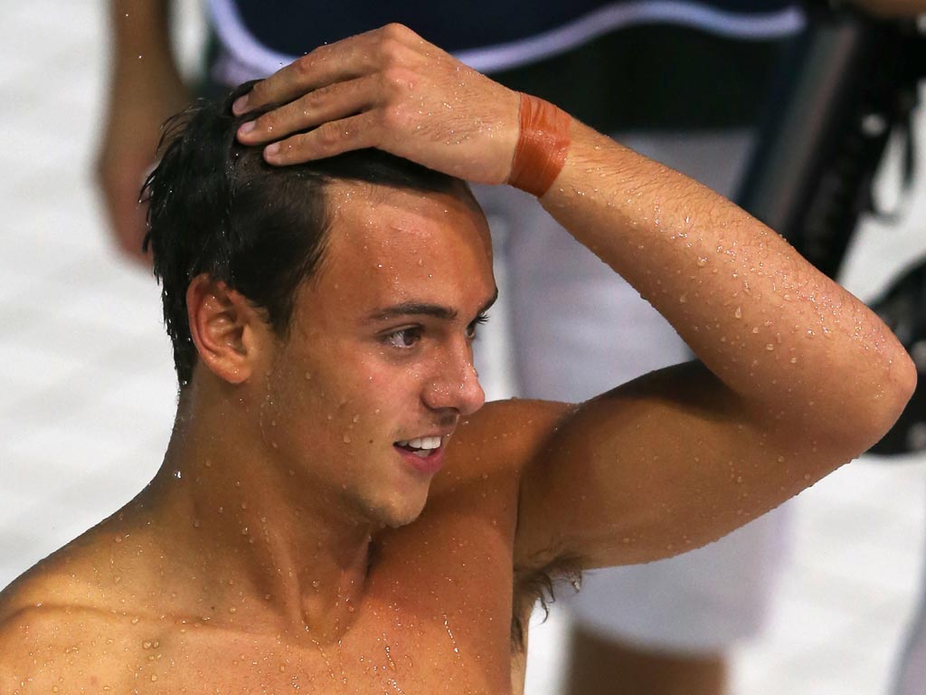 Tom Daley looks on at the Aquatics centre where he and his partner finished fourth