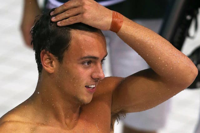 Tom Daley looks on at the Aquatics centre where he and his partner finished fourth