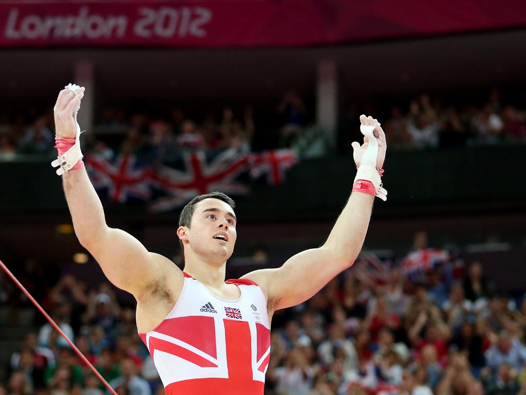 July 30, 2012: Kristian Thomas of Great Britain reacts after he competes on the horizontal bar in the Artistic Gymnastics Men's Team final