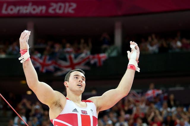 July 30, 2012: Kristian Thomas of Great Britain reacts after he competes on the horizontal bar in the Artistic Gymnastics Men's Team final 