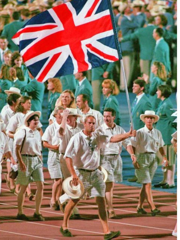 British rower Steve Redgrave carries the flag of his delegation in 1996