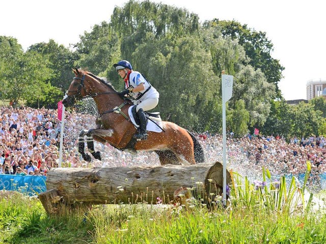 Zara Phillips, on High Kingdom, competes in the cross-country
section yesterday