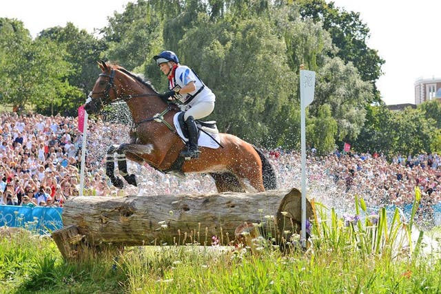 Zara Phillips, on High Kingdom, competes in the cross-country
section yesterday