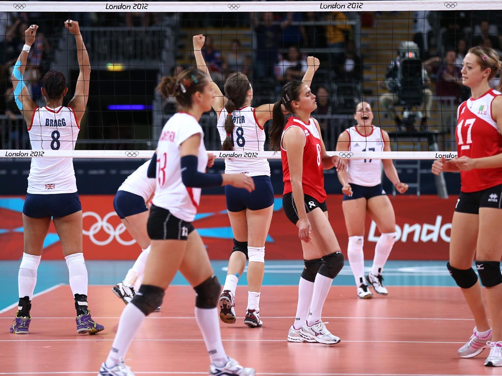 Great Britain players celebrate winning the Women's Volleyball Preliminary match between Great Britain and Algeria