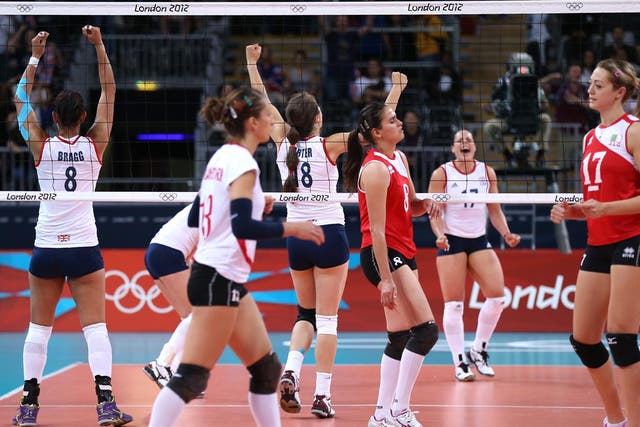 Great Britain players celebrate winning the Women's Volleyball Preliminary match between Great Britain and Algeria