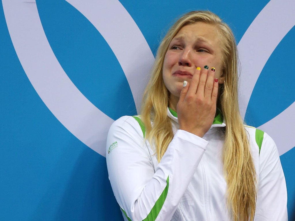 Ruta Meilutyte crys as she receives her gold medal