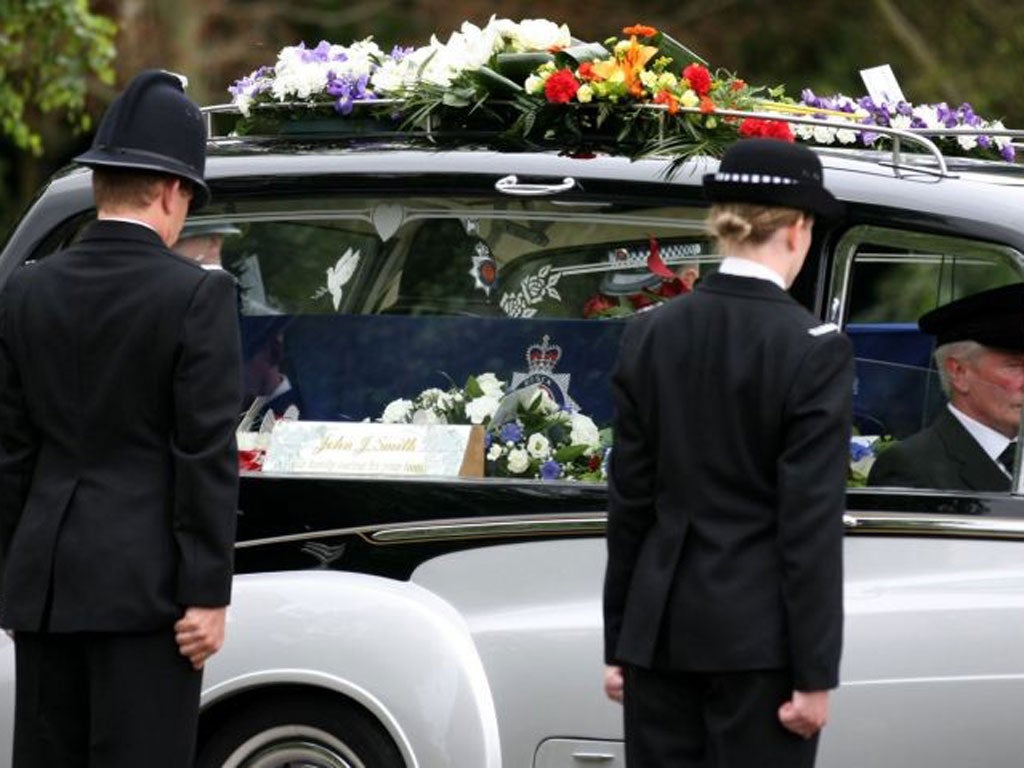The silver and black hearse carrying Pc Dibell's coffin, draped in an Essex police flag, was ushered into the grounds of Weeley Crematorium today by a guard of honour of 24 officers.