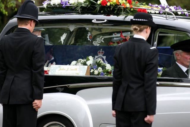 The silver and black hearse carrying Pc Dibell's coffin, draped in an Essex police flag, was ushered into the grounds of Weeley Crematorium today by a guard of honour of 24 officers.