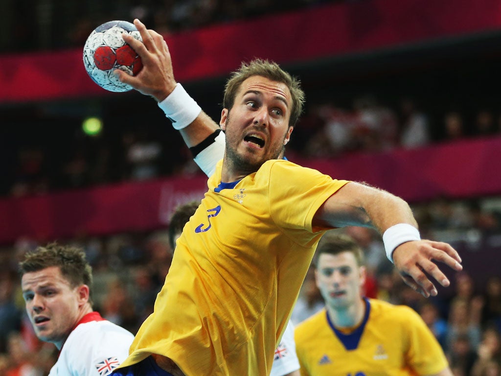 Mattias Gustafsson of Sweden shoots and scores during the Men's Handball Preliminary match between Great Britain and Sweden