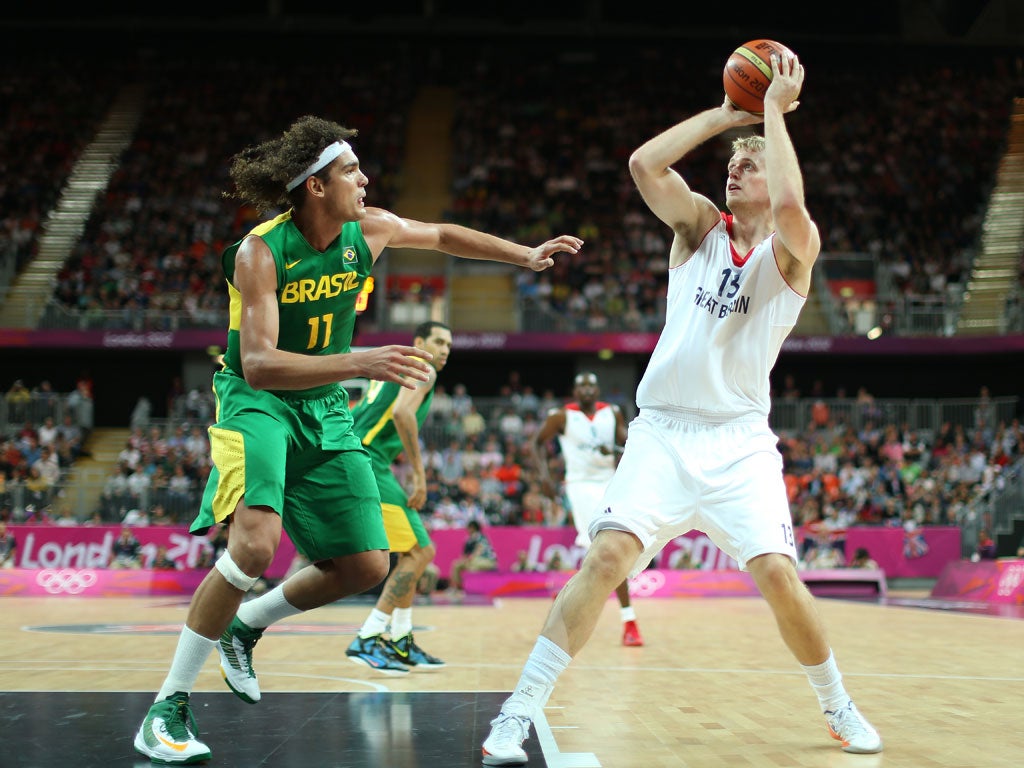 Dan Clark of Great Britain shoots over Anderson Varejao of Brazil in the Men's Basketball