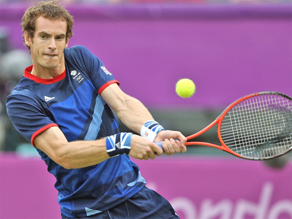 Andy Murray plays a backhand during his win over Jarkko Nieminen