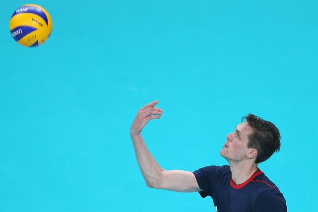 Ben Pipes of Great Britain serves the ball in the third set against Australia