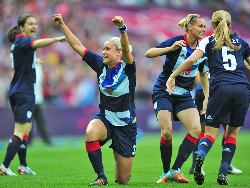 Steph Houghton and her Great Britain teammates celebrate scoring the winner