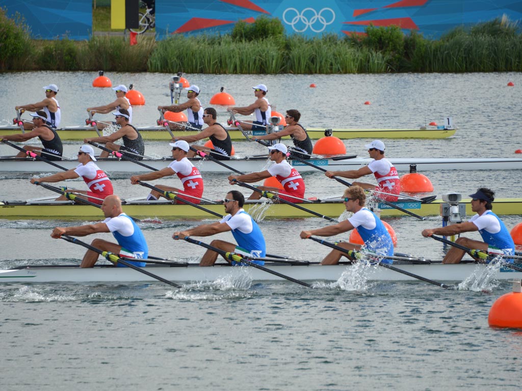 August 1, 2012: (From foreground) Rowers of Italy, Switzerland, New Zealand and the US start running the men's quadruple sculls repechages 1 of the rowing event during the London 2012 Olympic Games, at Eton Dorney
