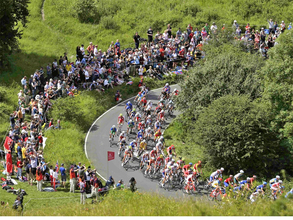 Slipstream: fans watch the men's cycle race at Box Hill on Saturday