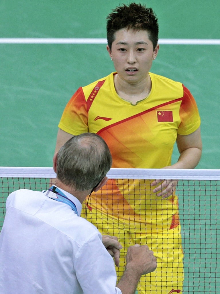 A badminton official talks to China's Yu Yang on Tuesday