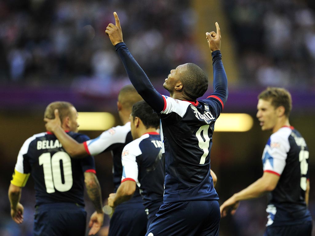 Great Britain's striker Daniel Sturridge celebrates after scoring during the London 2012 Olympic Games men's football match between Britain and Uruguay at the Millennium Stadium in Cardiff