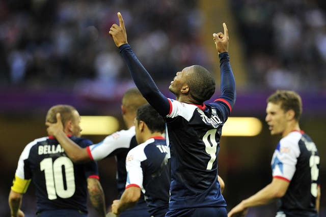 Great Britain's striker Daniel Sturridge celebrates after scoring during the London 2012 Olympic Games men's football match between Britain and Uruguay at the Millennium Stadium in Cardiff