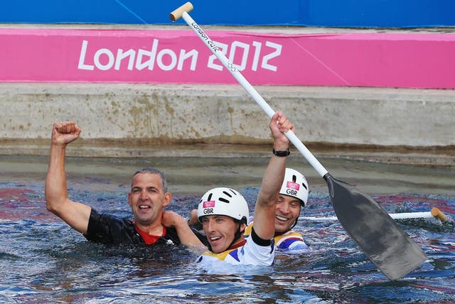 August 2, 2012: Gold medalists Etienne Stott (C) and Tim Baillie (R) of Great Britain celebrate after the Men's Canoe Double (C2) Slalom final