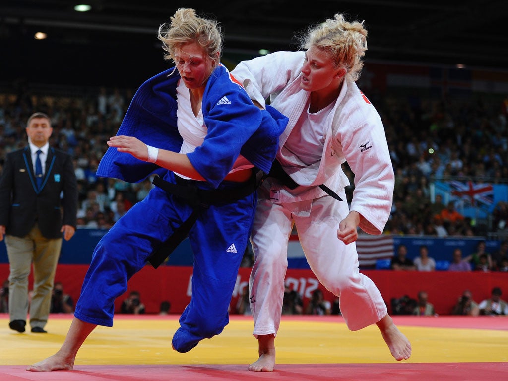Kayla Harrison (right) tussles with Great Britain's Gemma Gibbons