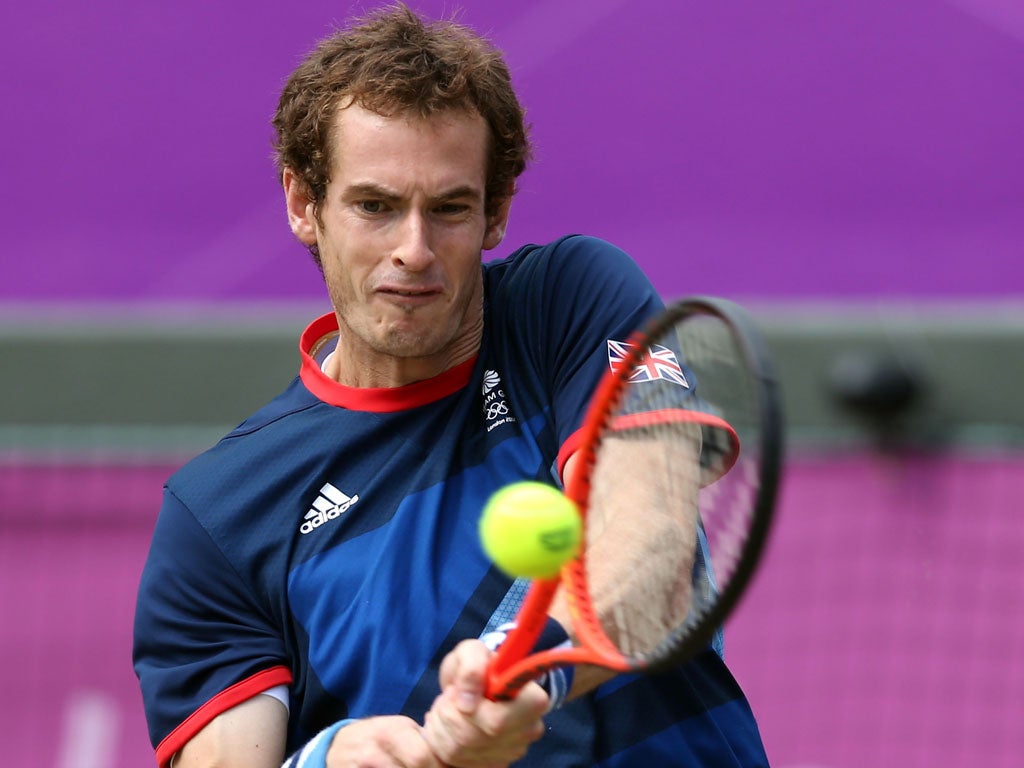 Andy Murray, of Great Britain, returns a shot to Nicolas Almagro