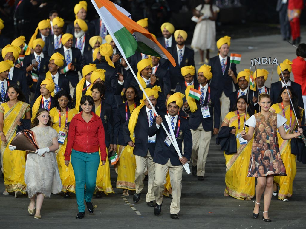 Madhura Nagendra, in red, joins in with India's parade