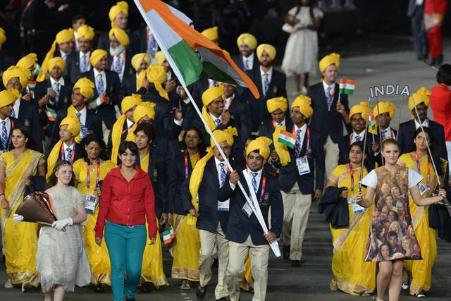 Madhura Nagendra, in red, joins in with India's parade