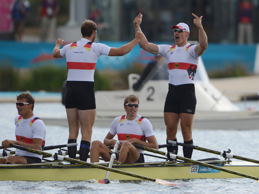 August 3, 2012: Germany's Tim Grohmann, Lauritz Schoof, Phillipp Wende and Karl Schulze celebrate after winning the gold medal in the men's quadruple sculls final