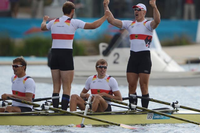 August 3, 2012: Germany's Tim Grohmann, Lauritz Schoof, Phillipp Wende and Karl Schulze celebrate after winning the gold medal in the men's quadruple sculls final