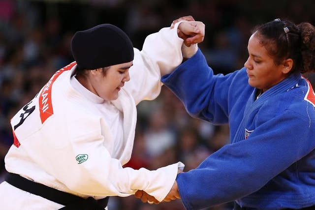 Wojdan Shaherkani of Saudi Arabia (left) competes with Melissa Mojica of the United States in the Women's +78 kg Judo on Day 7 of the London 2012 Olympic Games
