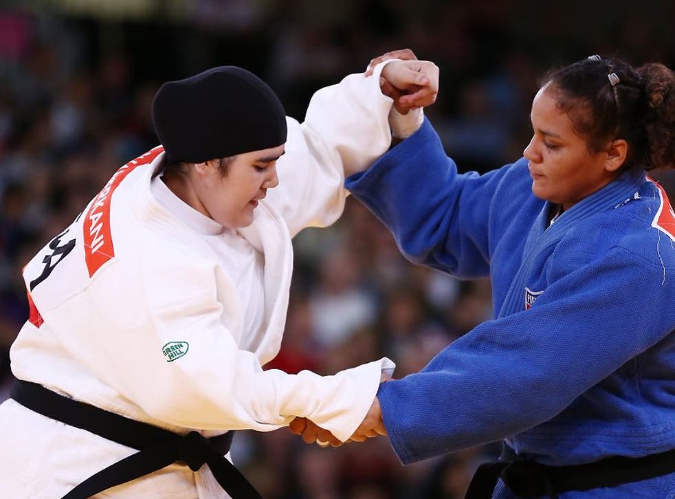 Wojdan Shaherkani of Saudi Arabia (left) competes with Melissa Mojica of the United States in the Women's +78 kg Judo on Day 7 of the London 2012 Olympic Games