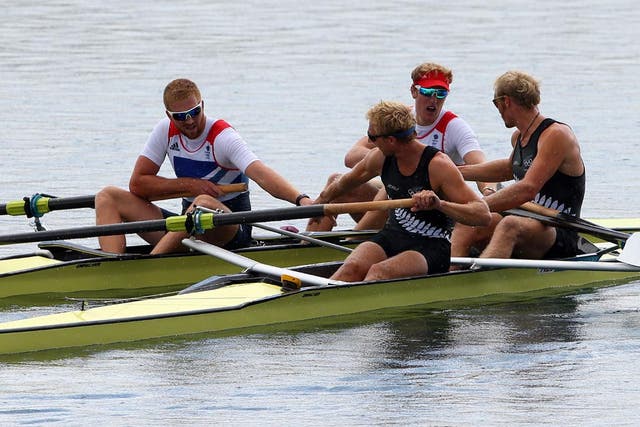 August 3, 2012: Hamish Bond and Eric Murray of New Zealand are congratulated by William Satch and George Nash of Great Britain as they celebrate winning gold in the Men's Pair final