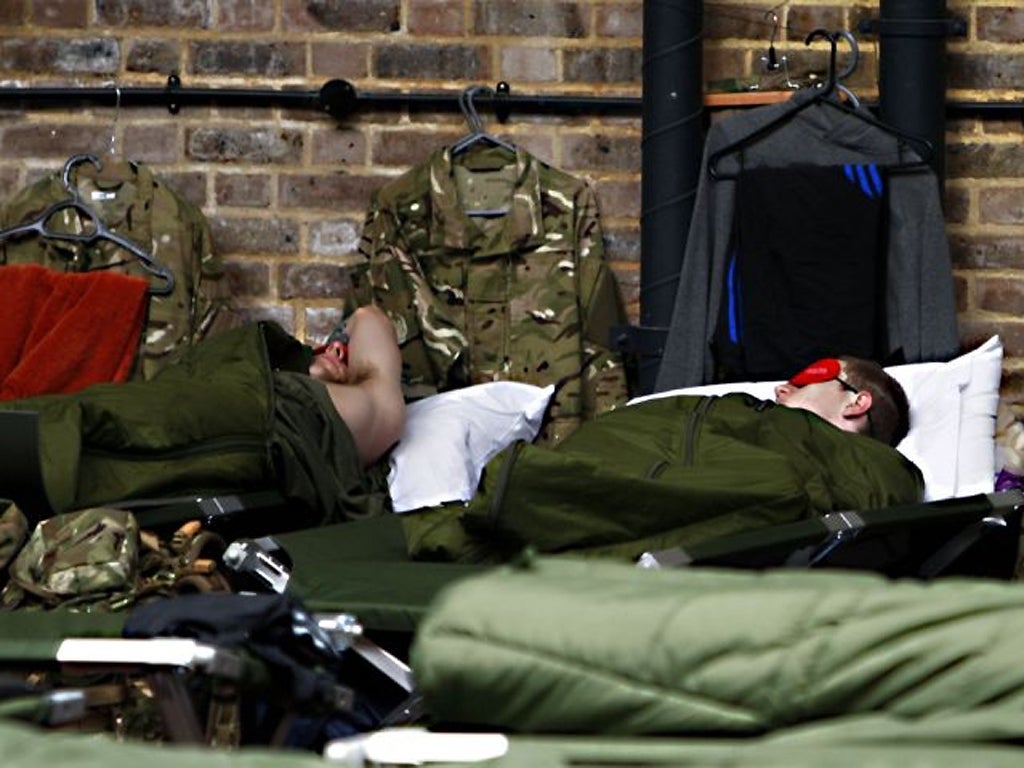 Members of the armed forces at rest at Tobacco Dock as Mayor of London Boris Johnson visited