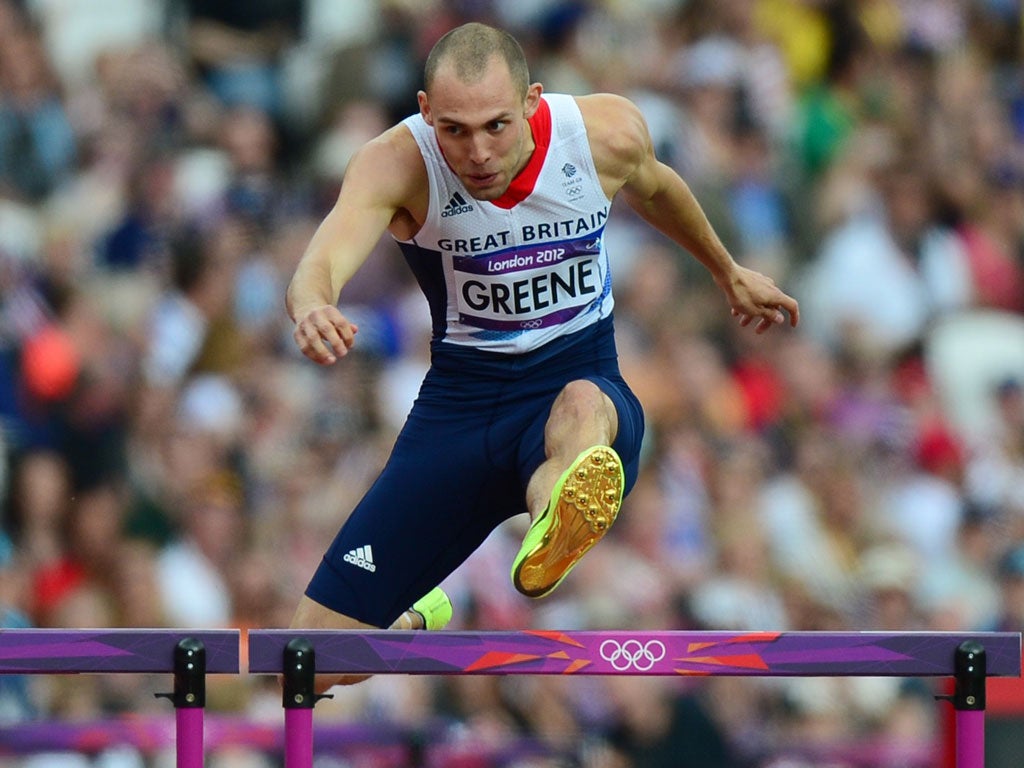 Dai Greene competes in the 400m hurdles heats yesterday