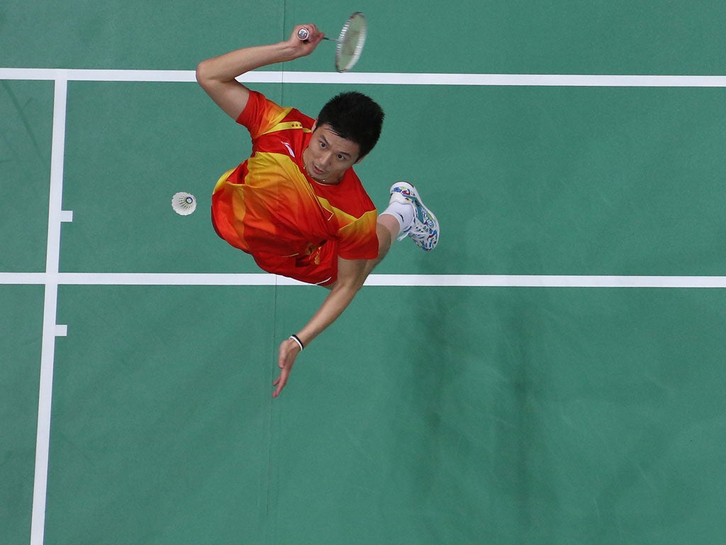 Haifeng Fu of China competes in his Men's Doubles Badminton Semi Final match against Boon Heong Tan and Kien Keat Koo of Malaysia