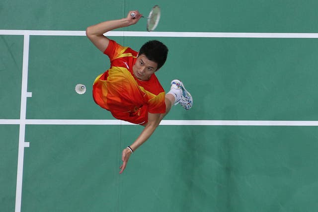Haifeng Fu of China competes in his Men's Doubles Badminton Semi Final match against Boon Heong Tan and Kien Keat Koo of Malaysia 