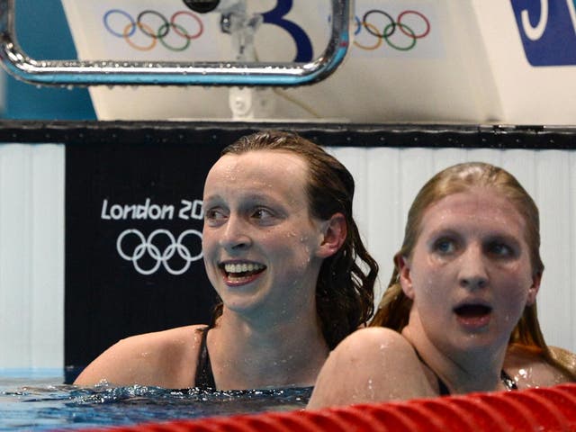 US swimmer Katie Ledecky (left) reacts after she won gold next to third-placed Britain's Rebecca Adlington after they competed in the women's 800m freestyle final