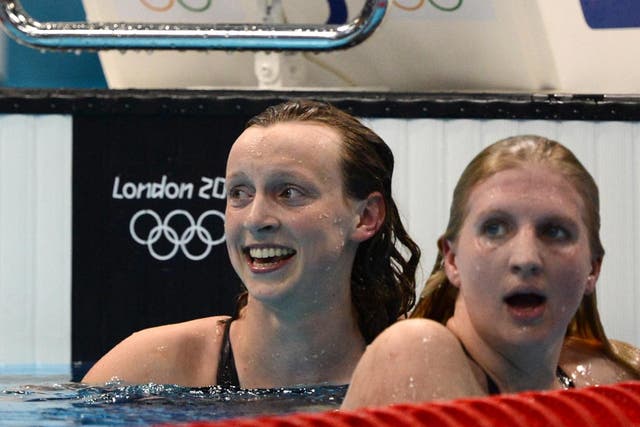 US swimmer Katie Ledecky (left) reacts after she won gold next to third-placed Britain's Rebecca Adlington after they competed in the women's 800m freestyle final