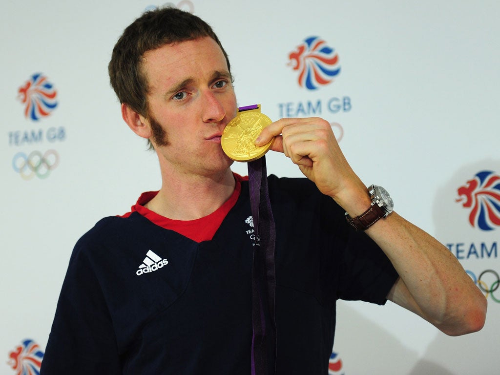 Bradley Wiggins wins gold for the men's individual time trial cycling event on day five of the Olympics